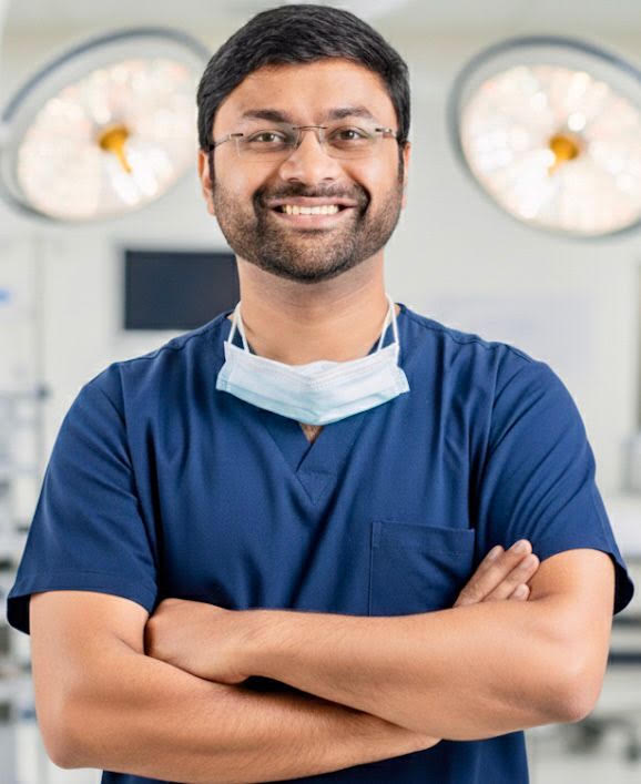 Dr. Ruthrendhra E in surgical scrubs